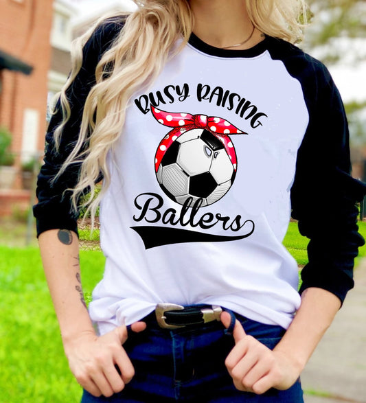 Busy Raising A Baller Soccer Ball Soccer Mom Graphic Tee Sports Mom Raglan Shirt