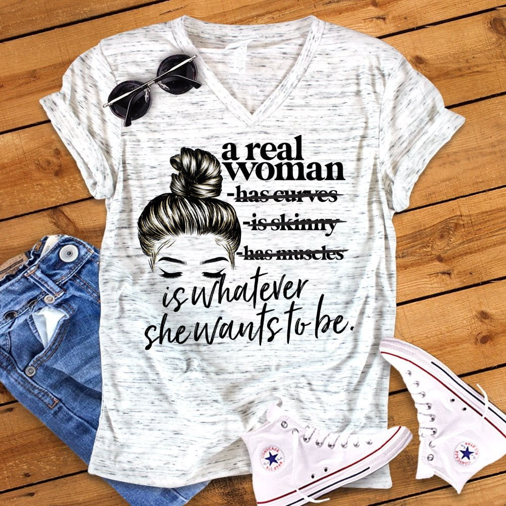 A Real Woman Is Whatever She Wants To Be Bella Unisex V Neck T-Shirt